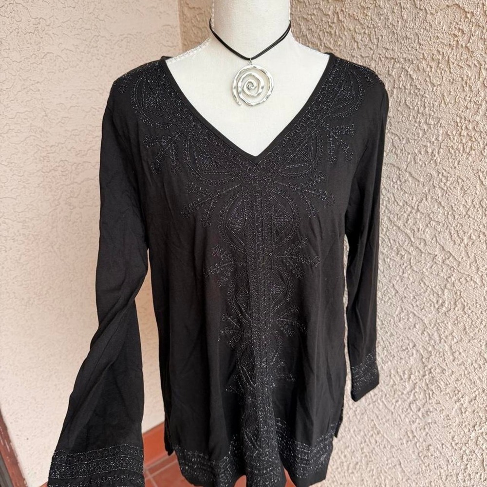 Black glittery long sleeve top with bell sleeves and V-neckline